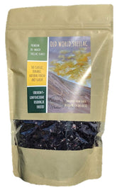 Old World Shellac garnet flakes in a 1 lb bag for wood finishing.
