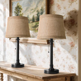Oneach dark brown metal lamp body adds a sleek farmhouse touch to a nightstand.