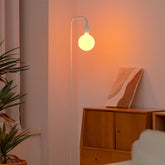 ONEWISH floor lamp with globe bulb for a cozy, non-glare living room glow.