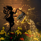 Ouddy Decor fairy garden decor with solar watering can lights up at night for magical outdoor ambiance.
