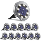 OULONGER solar ground lights lighting a garden path with bright 8-LED glow.