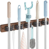 OUTNILI mop and broom holder mounted on wood wall for easy access