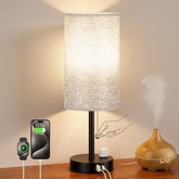 PartageiZ bedside lamp grey body offers soft illumination for reading at night.