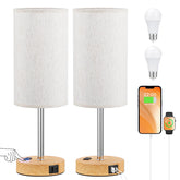 Partageiz bedside lamps on a nightstand with touch controls offering adjustable brightness.