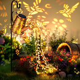 PATIOPIA solar watering-can lantern lights garden paths at dusk