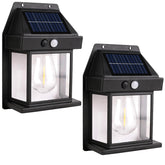 PeakPlus solar wall lights 2-pack mounted on exterior wall for porch security
