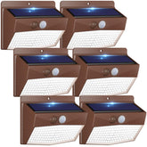 Peasur brown solar outdoor lights along a fence providing ambient illumination