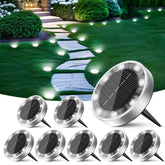 Peasur solar ground light disk 8-pack illuminates pathways with energy-efficient glow.