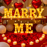 Peledic Marry Me letters sign glowing softly for a romantic proposal backdrop.