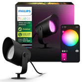Philips Hue Lily XL outdoor spot light illuminating a walkway with color ambiance