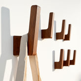 PinEther 6-pack walnut wall hooks with hidden mount for a clean, floating look.