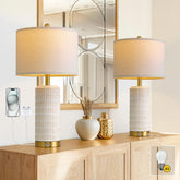 PoKat Touch bedside lamp with white ceramic body and gold base for stylish bedroom lighting.