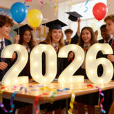 Pooqla 2026 light-up numbers on table create a warm centerpiece for graduations