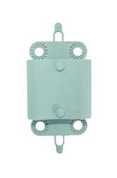 Porcupine shower hair catcher on sage-green wall catching hair to reduce clogs