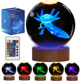 POSSHE axolotl night light in glass sphere creates soft ambient glow on a shelf