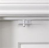 Predictable Solutions GlideLok door top lock on front view enhances child safety.