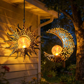 QCF solar sun and moon hanging lanterns glow warmly for outdoor evenings.