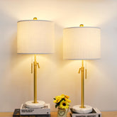 Qingmiao table lamp with gold finish and marble base for modern bedroom ambiance.