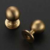 Ravinte Decor champagne bronze round knob angled view highlights comfortable grip and stylish hardware.