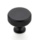 Ravinte round knob in matte black enhances kitchen cabinets with a sleek, durable finish.