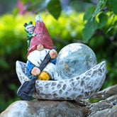 Rezpuao garden gnome statue with solar light enhances outdoor charm and night visibility.
