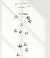 Rodudu disco ball mobile with spiral spinner casting dynamic reflections for indoor parties.