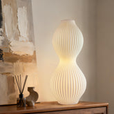 RONDURE ceramic table lamp side view for a cozy bedroom glow.