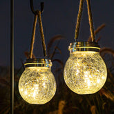 ROSHWEY 2 pack solar lanterns hanging outdoors for warm ambience