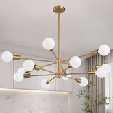RUIYEY 12-light Sputnik chandelier in gold enhances dining room ambiance.