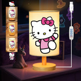 Sapouni Kitty bedside lamp with wood base provides warm lighting on a nightstand.