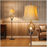 Scenekoy rustic antlers floor lamp with tree stump base for a warm living room