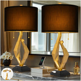 Scenekoy sculptural table lamp with gold leaf finish enhances an elegant living room ambiance