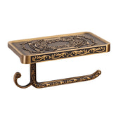 SDH antique brass toilet paper holder with shelf for organized bathroom storage.