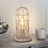 Seaside Village small table lamp with openwork shade adds farmhouse charm to a bedroom.