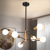 Sheetea sputnik chandelier in black and gold over dining room for stylish illumination.
