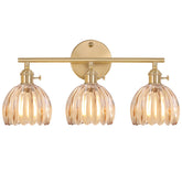 Shenmoyl 3-light brass vanity light with amber tulip shade over mirror for warm bathroom glow