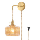 Shenmoyl vintage sconce with amber striped shade producing a warm glow
