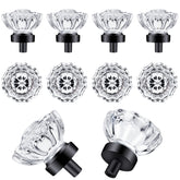 SHINY HANDLES glass crystal knob with matte black base on cabinet captures light for a timeless sparkle.
