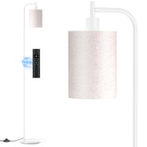 SIBRILLE floor lamp with linen shade and weighted base for stable placement.