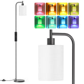 SIBRILLE RGB floor lamp with linen shade adds warm ambience to living spaces.