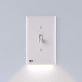 SnapPower SwitchLight wall-faceplate close-up shows a sleek night-light for safer nighttime navigation.