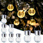 SOLPEX hanging solar light with cracked glass ball adds warm ambient glow outdoors