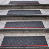 Spurtar rubber stair tread on wooden stairs showing anti-slip grip for outdoor safety.