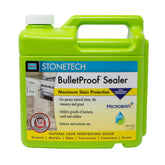 StoneTech BulletProof Sealer bottle pouring to illustrate protective action on stone surfaces.