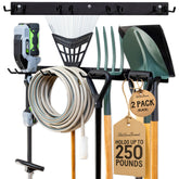 StoreYourBoard wall-mounted rack with four hooks keeps shovels and rakes off the floor for quick access.