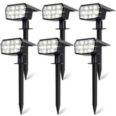 Sucolite 6-pack solar spot lights arranged along a garden path for outdoor illumination