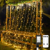 SUDDUS 300 LED warm white curtain lights framing a bedroom window with cozy ambiance.