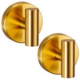 Supopular brushed gold suction hook securing towels on glass or tile.