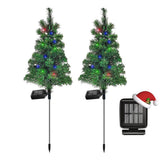 SXXSMYWR solar Christmas tree stake with four-color LEDs illuminating outdoor pathways without wires.