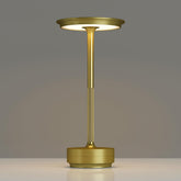 TBBGA cordless table lamp in gold finish creating ambient dining lighting